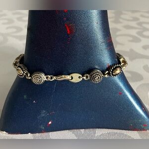 Signed Avon SH silver-tone bracelet with lobster claw closure